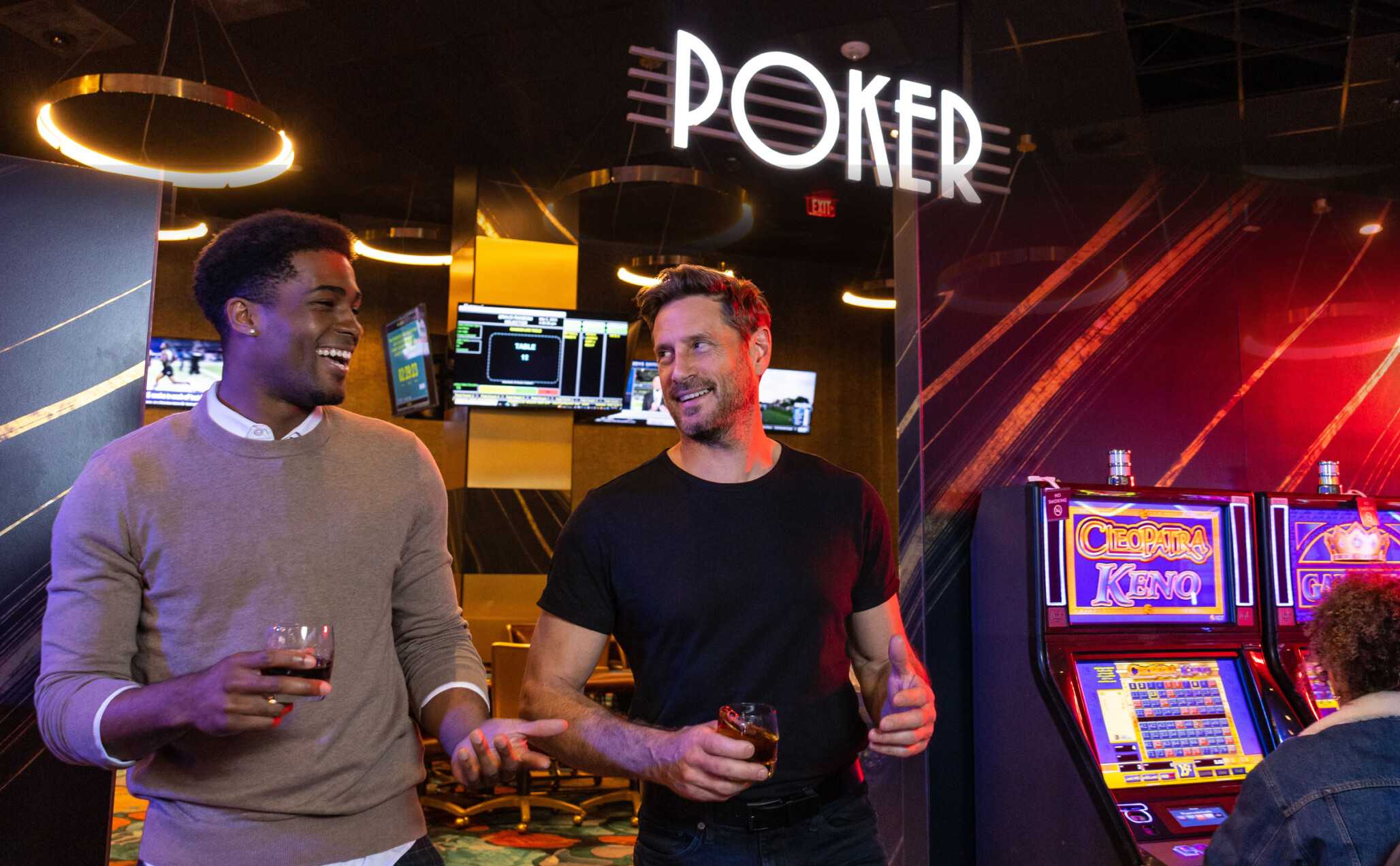 Young men have fun while playing in Jamul Casino's poker room.